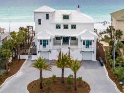 Aerial view of white beachfront home